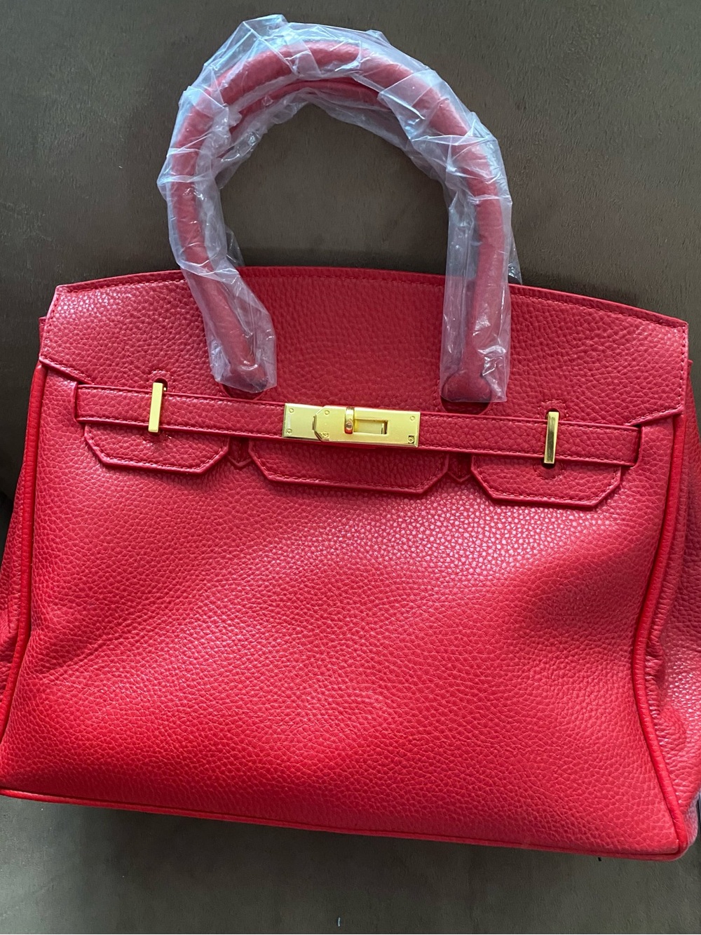 Elegant Red Pebbled Leather Tote with Gold Hardware